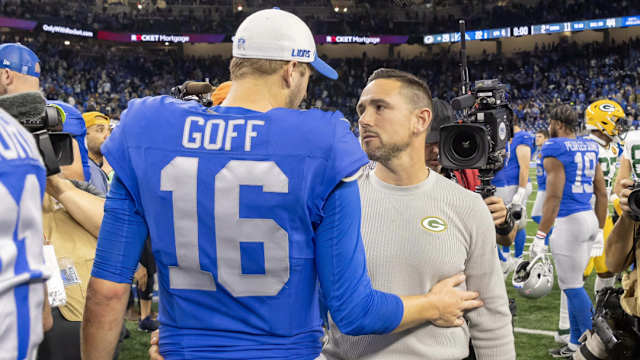 Detroit Lions quarterback Jared Goff shakes hands with Green Bay Packers coach Matt LaFleur.